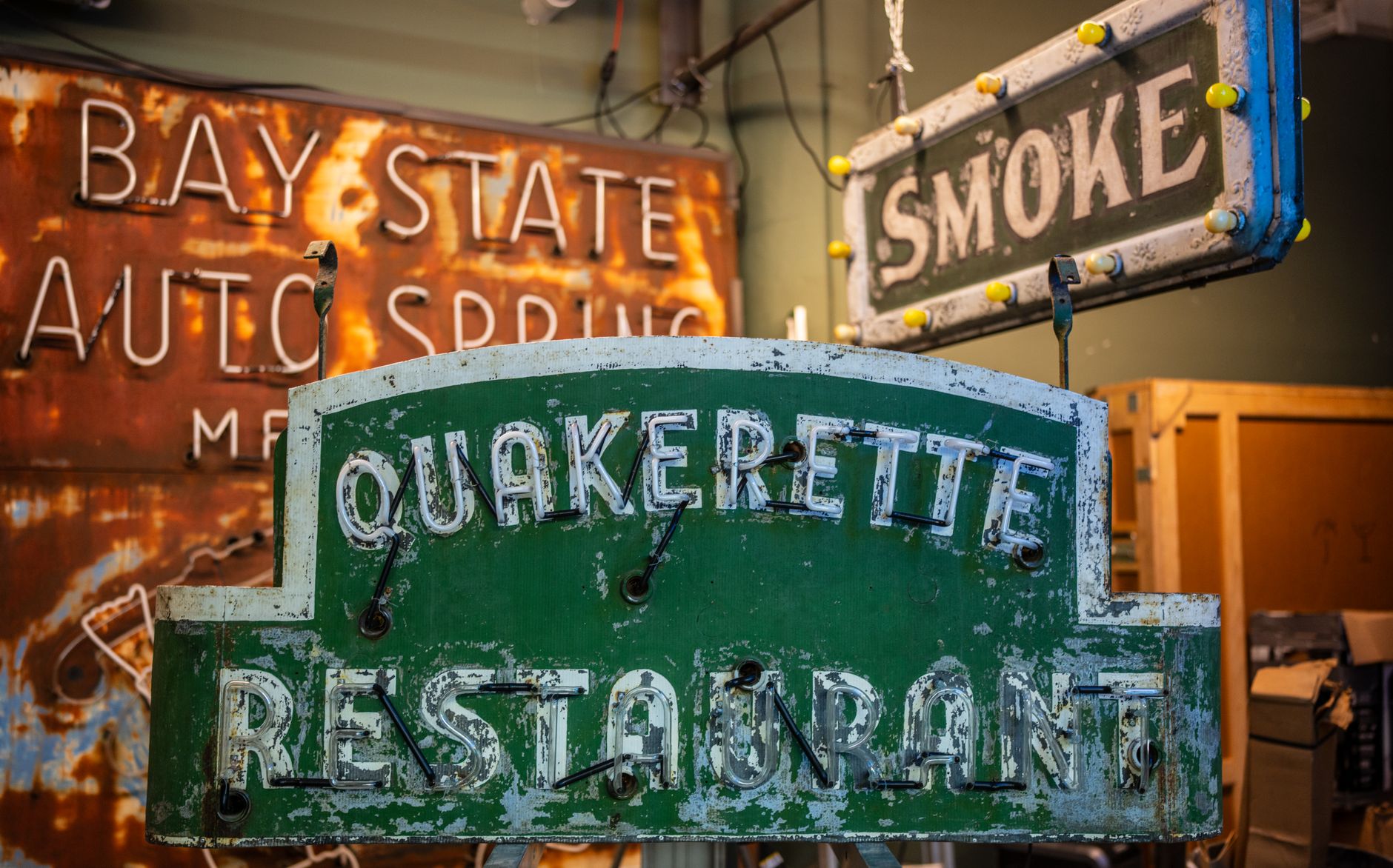 Bright neon VINTAGE sign glowing in a shop window